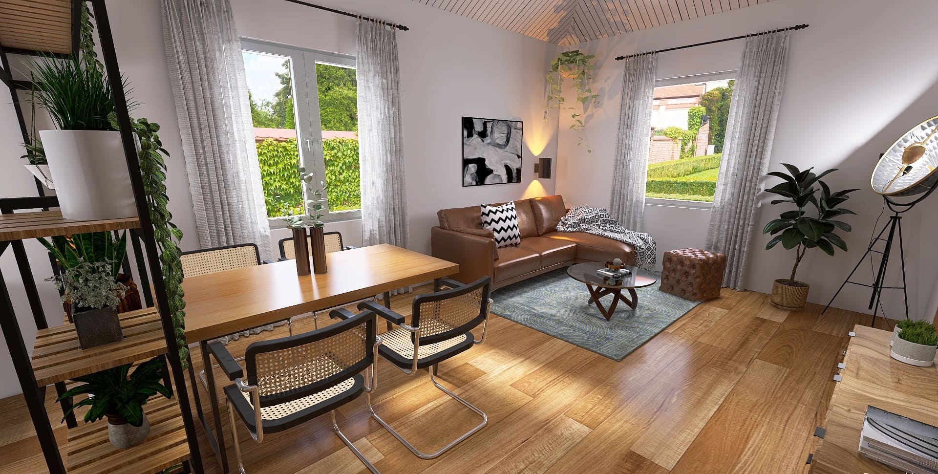Wohnzimmer mit Essbereich im Industrial Stil mit Ledercouch und Freischwinger-Stühlen aus Geflecht