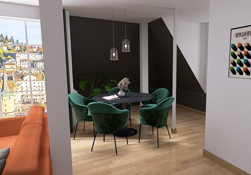 Offenes Wohn-Esszimmer mit dunkelgrau gestrichenen Dachschrägen