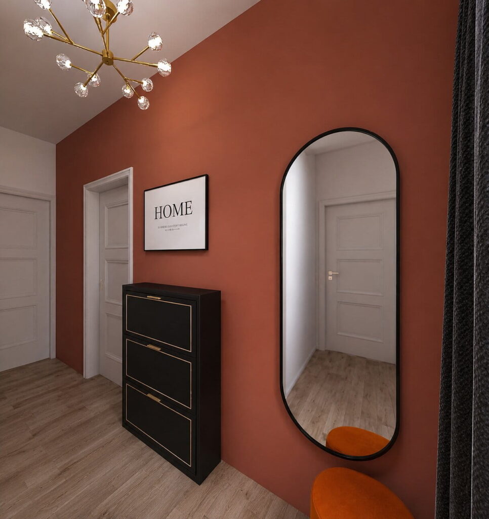 Eleganter Eingangsbereich in Ferienwohnung mit Wand in Terrakotta und Spiegel